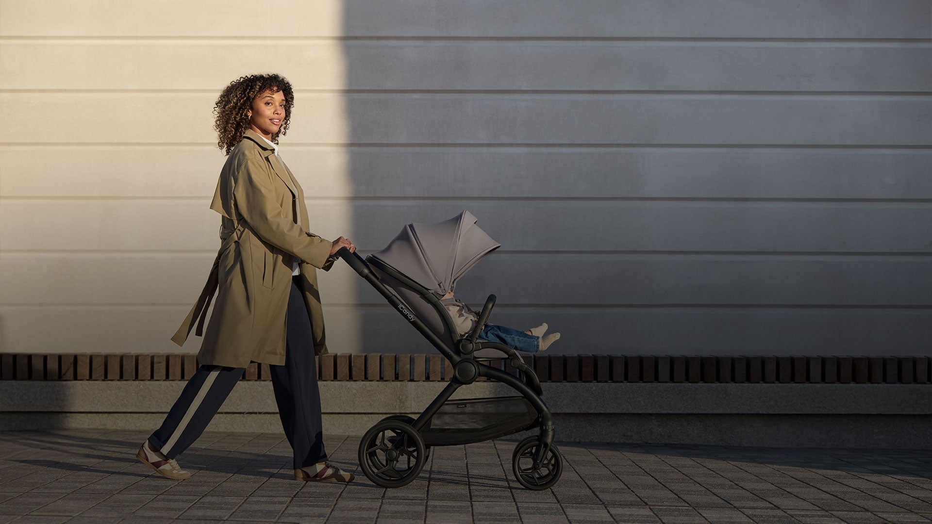 Parent walking with an iCandy Core 2 pushchair