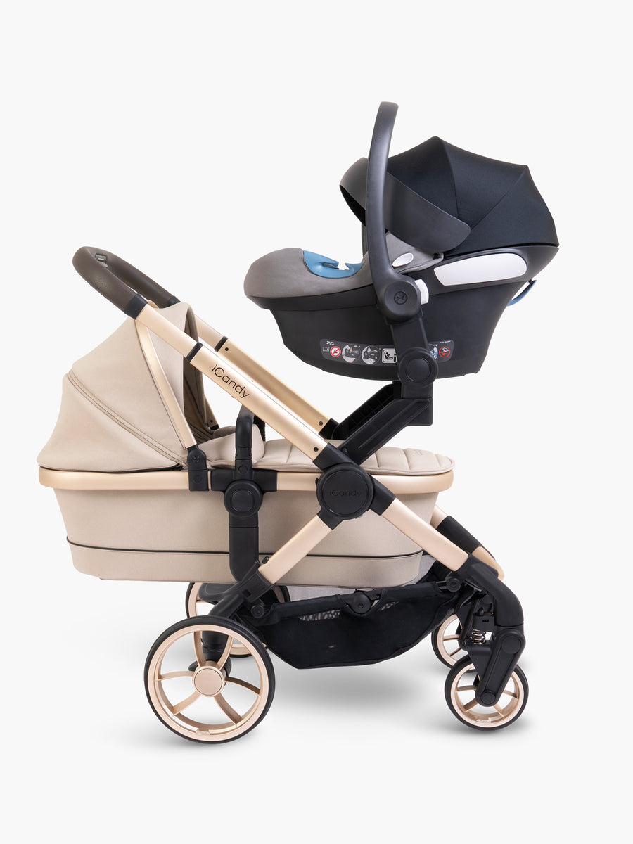 Beige stroller with black car seat on a white background